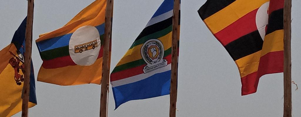 THE UGANDA FLAG, EAST AFRICAN COMMUNITY FLAG, NRM FLAG AND TOORO KINGDOM FLAG THE UGANDA FLAG, EAST AFRICAN COMMUNITY FLAG, NRM FLAG AND TOORO KINGDOM FLAG